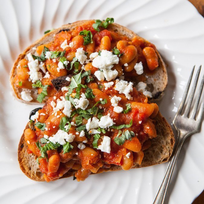 garlic white beans and tomatoes on toast